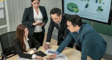 Modern Asian businessman with high confidence Committed to working together as a harmonious team Having a professional planning meeting at the company